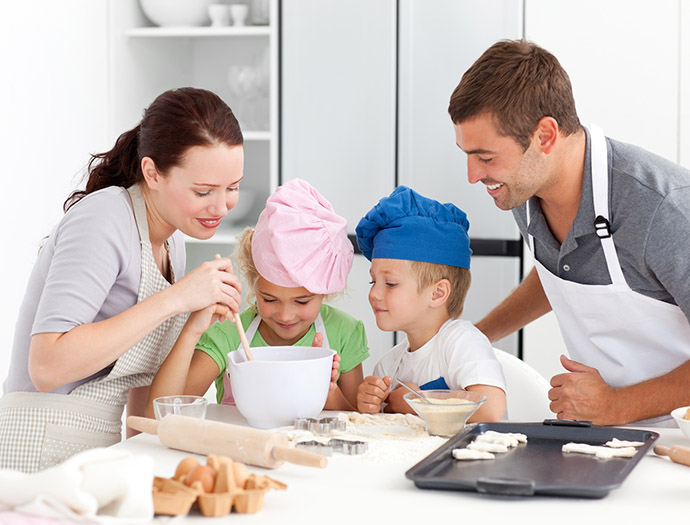 Adorable family baking together in the kitchen