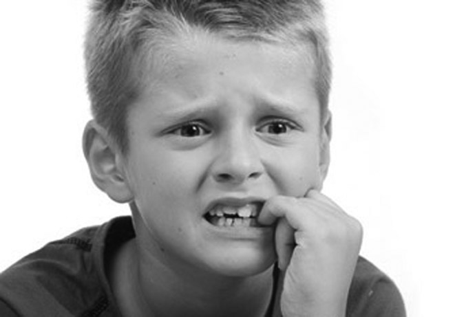 Stress expression on little blond kid's face