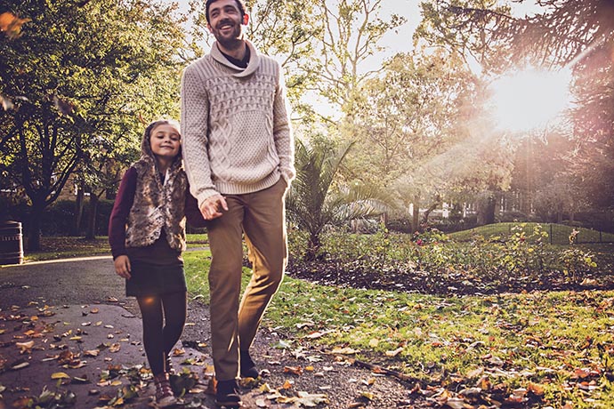 father-and-daughter-walking-in-the-park-together-1
