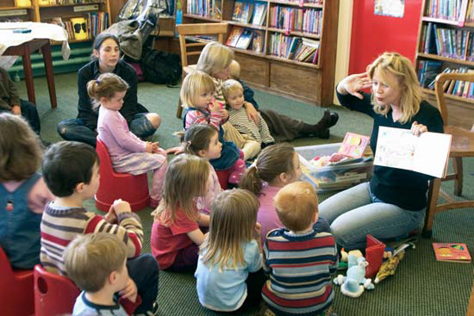 group of young children during story time at the library